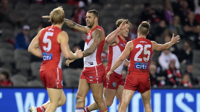 Swans players are up and about as they celebrate a goal from Luke Parker in their demolition of St Kilda. Picture: AAP Image/Mark Dadswell