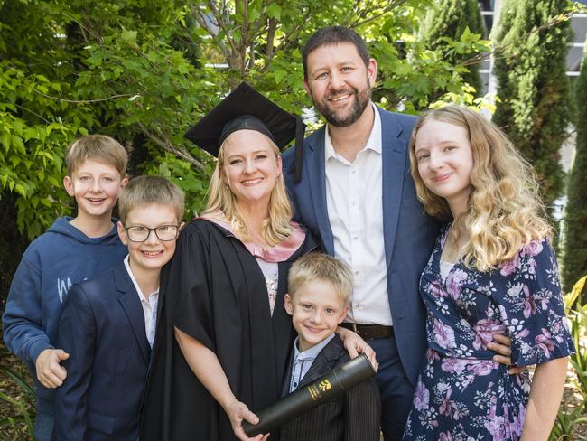 Master of Education (Distinction) graduate Lisa Evans with family (from left) Hyrum, Thomas, Ben, Brendon and Emily Evans at a UniSQ graduation ceremony at Empire Theatres, Tuesday, October 31, 2023. Picture: Kevin Farmer