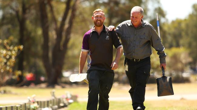 Rookwood Cemetery’s head grave digger Mark Bundy (right) with stonemason Matthew Johnson.