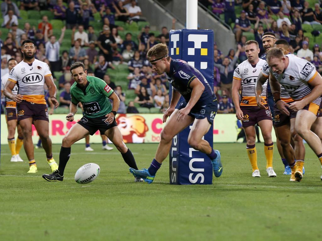 Cameron Munster of the Storm chases his kick to score a try. Picture: Darrian Traynor/Getty Images