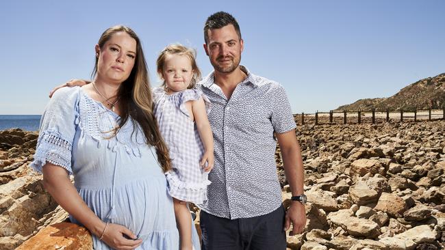 Chloe, Meadow and Andrew Kowalczuk at O'Sullivan Beach where Port Stanvac remains closed. Picture: Matt Loxton