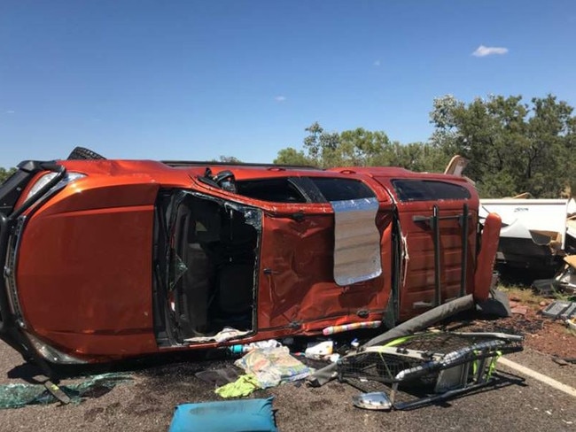 A strong gust of wind rolled over a car towing a caravan near Elliot. Picture: NTPFES