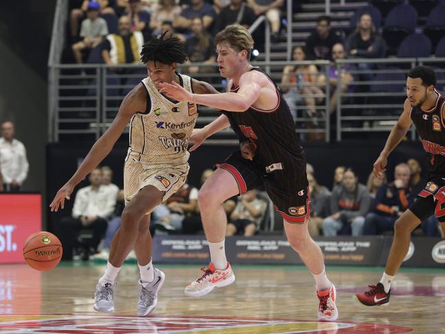 Bobi Klintman of the Cairns Taipans dribbles the ball under pressure from Lachlan Olbrich of the Hawks at the NBL Blitz 2023. (Photo by Russell Freeman/Getty Images for NBL)