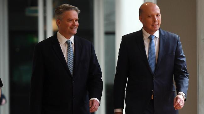 Finance minster Mathias Cormann and home affair minister Peter Dutton. Picture: AAP