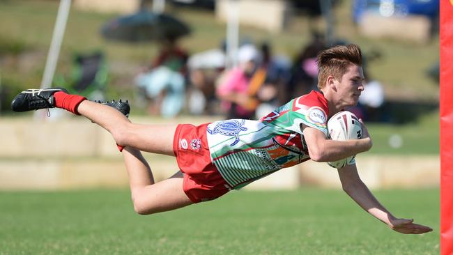 Emu Park's Travis Field scores a try.