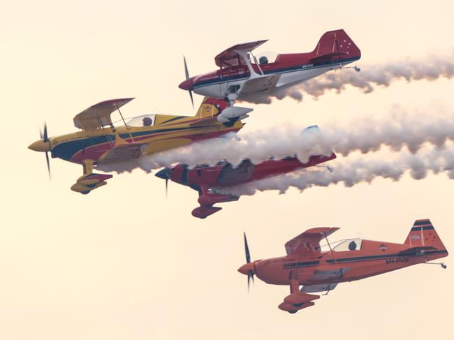 Paul Bennett and the stunt team fly in close formation before the crash. Picture: David Caird
