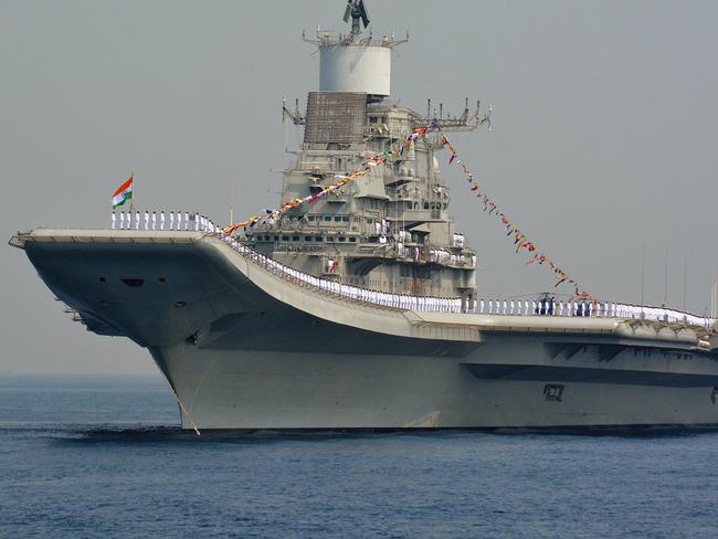 Indian Navy personnel stand on the INS Vikramaditya, a modified Kiev-class aircraft carrier, similar to the aircraft carrier Liaoning operated by China. Picture: AFP