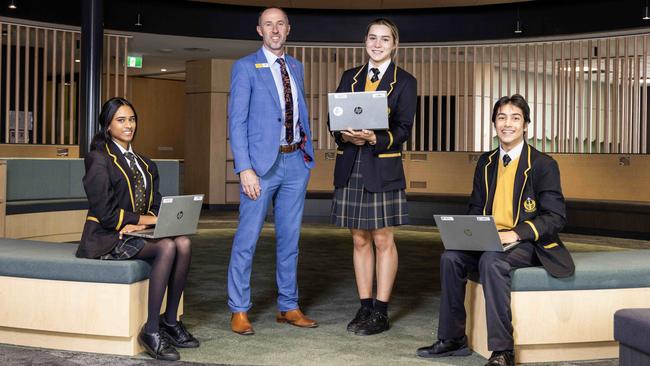 Nazareth Catholic College has experienced strong growth due to a surge in enrolment. Principal Andrew Baker is pictured with year 11 students Sahana, Dion and Alexia Snowdon who’ll move into a brand new senior campus in Kidman Park in Term 3. Picture: Kelly Barnes