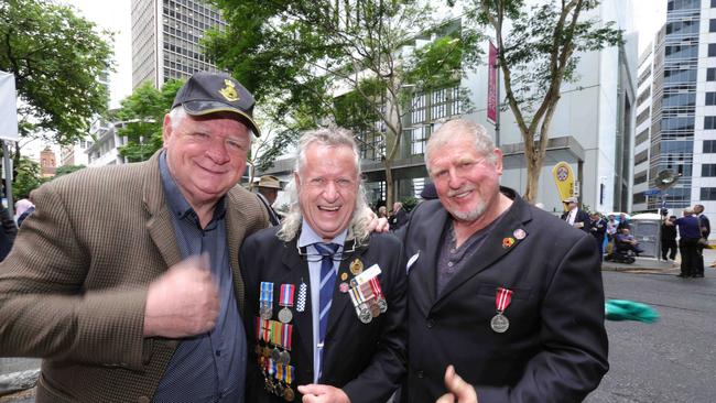 L to r, Alan Wilkins, Alex Gordon-Jones and Dean Rutherford all Sappers engineers 20Div ESS Support Squad, during the Anzac Day Parade, Brisbane City. Photo: Steve Pohlner