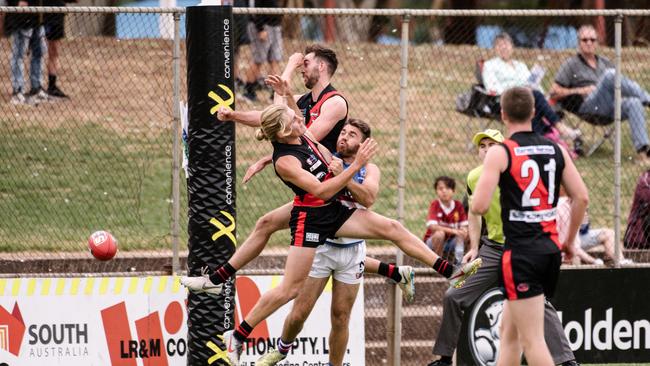 No backing away for Elliot Dunkin, Jonathon Beech and Isaya McKenzie at Elizabeth Oval. Picture: Morgan Sette/AAP