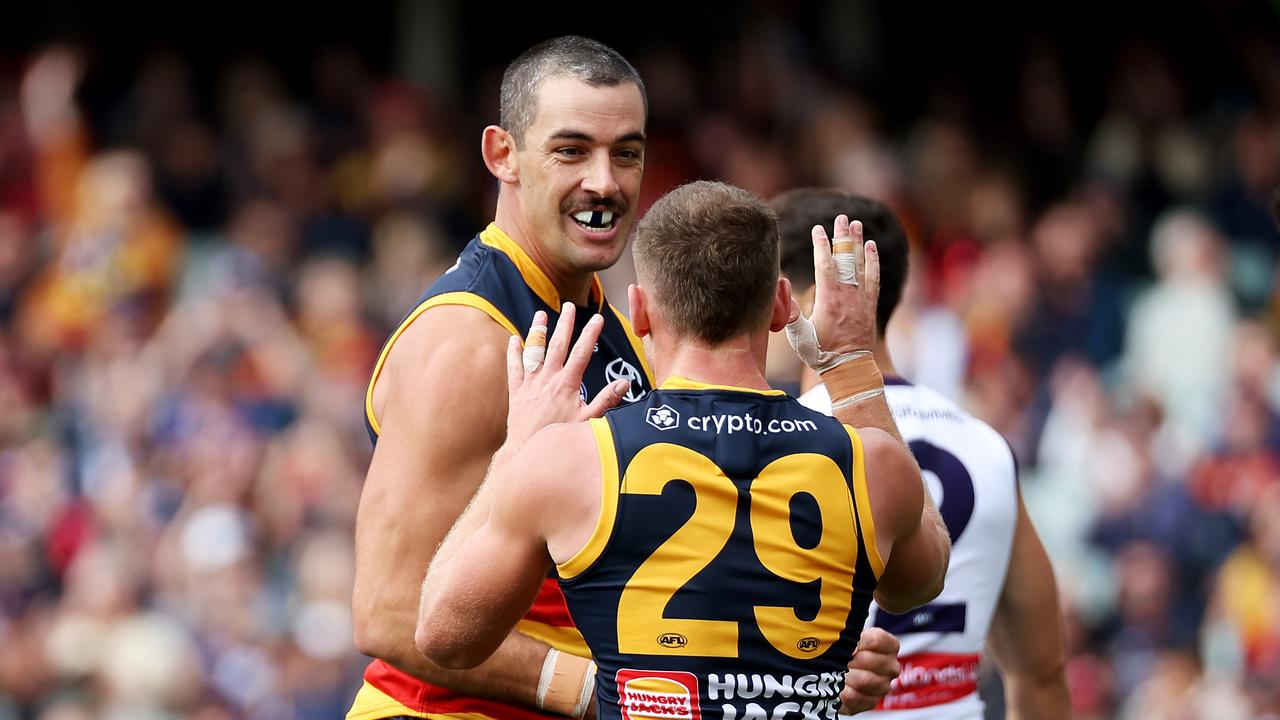 ADELAIDE - APRIL 08: Taylor Walker and Rory Laird of the Crows celebrate a goal during the 2023 AFL Round 04 match between the Adelaide Crows and the Fremantle Dockers at Adelaide Oval on April 8, 2023 in Adelaide, Australia. (Photo by James Elsby/AFL Photos via Getty Images)