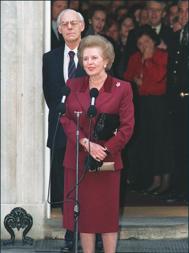 Thatcher, flanked by her husband Denis, addresses the press on 28 November 1990 for the last time in front of 10 Downing Street in London prior to hand her resignation as prime minister.