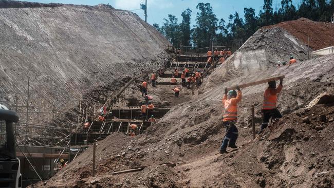 General view of workers at the rebuilding site next to the collapsed iron ore waste dam of Brazilian mining company Samarco, in Mariana, Minas Gerais State, Brazil, on October 26, 2016. Picture: AFP/ Yasuyoshi Chiba.