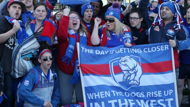 Bulldogs fans return to Melbourne after watching the Dogs win the preliminary final. Picture: David Crosling