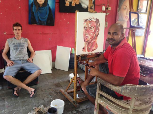 The late Myuran Sukumaran painting a portrait of Michael Czugaj inside Kerobokan Jail.