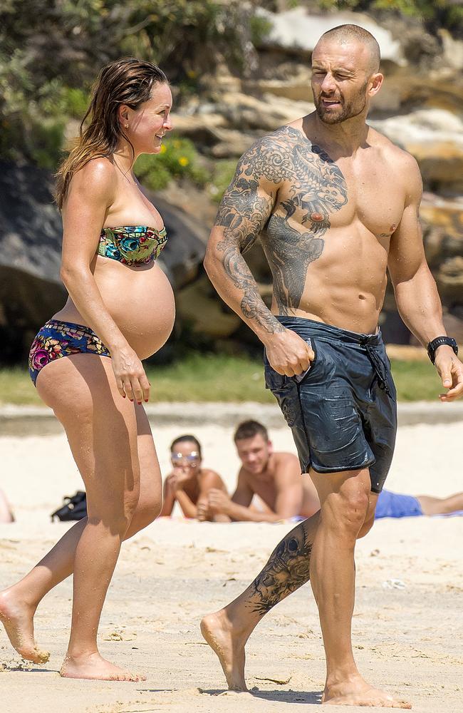 Michelle and The Commando enjoy a dip at Tamarama Beach. Picture: Matrix