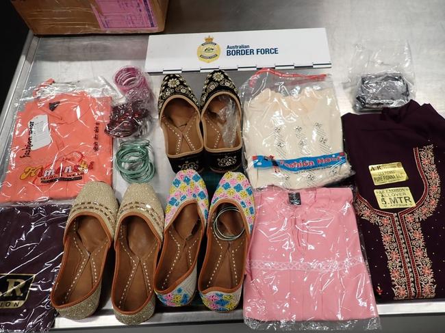 Australian Border Force officers arrested three men in Adelaide's western suburbs who have been accused of importing 25.7kg of opioids hidden inside clothing and groceries. Picture: Australian Border Force