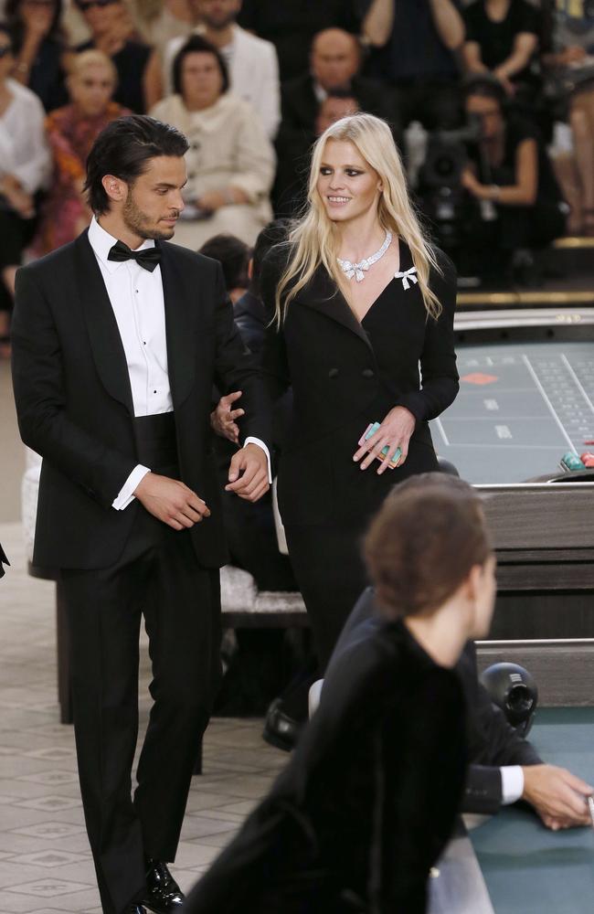 Dutch model Lara Stone (R) walks along French model Baptiste Giabiconi (L) during the Chanel 2015-2016 fall/winter Haute Couture collection fashion show. Picture: AFP