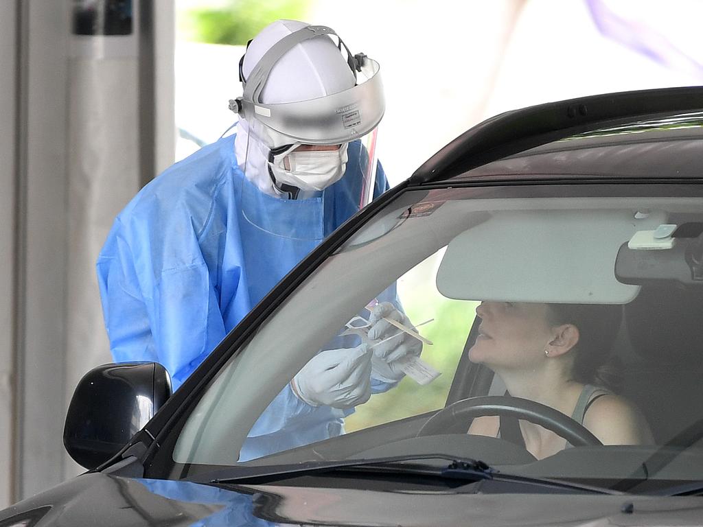 A woman is tested for Covid-19 at a drive-through clinic.