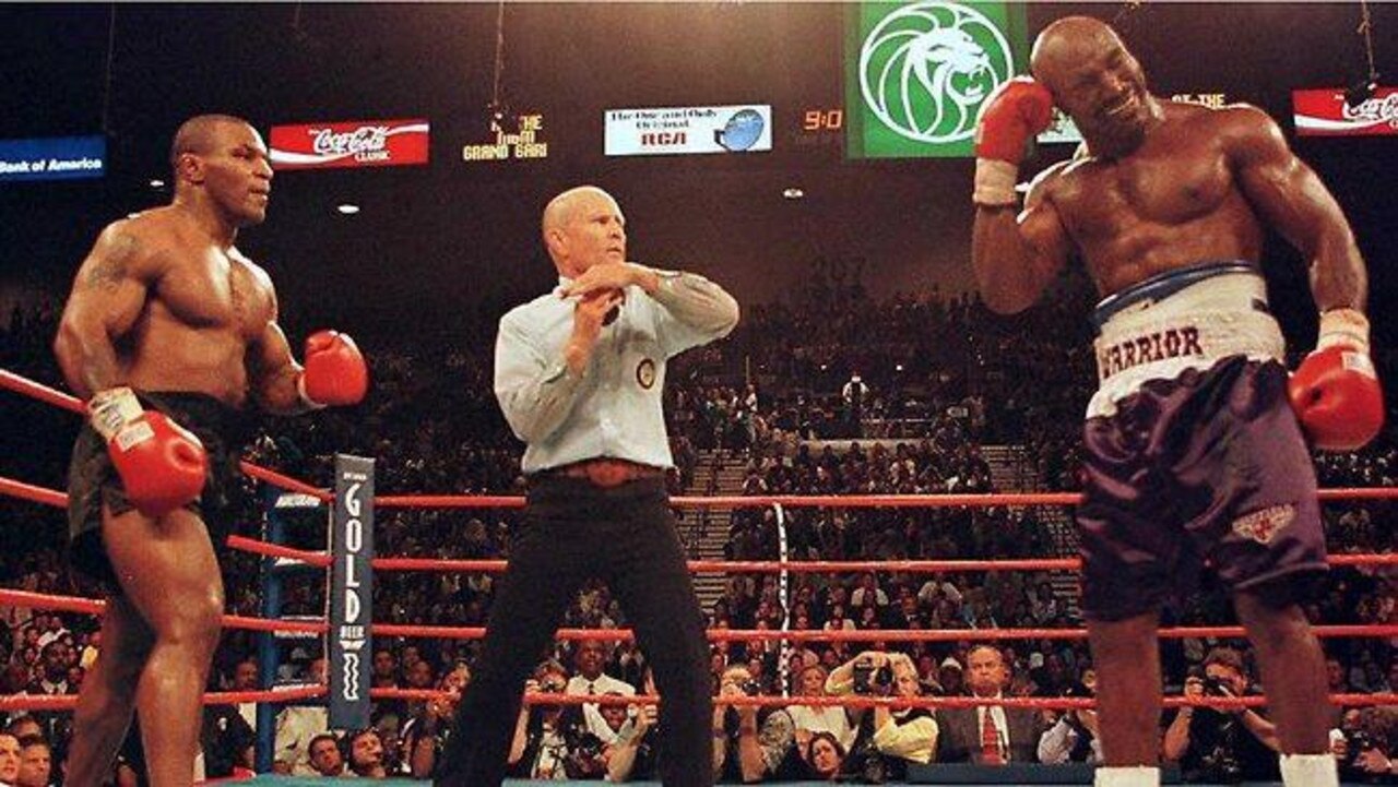 Evander Holyfield reacts after Tyson bit his ear in 1997. Photo: Supplied