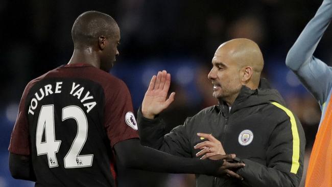 Manchester City's Yaya Toure and Pep Guardiola.