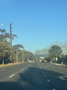 A plume of smoke from smouldering foliage in Aldgate could be seen as far as the western tip of Greenhill Rd. Picture: Kara Jung