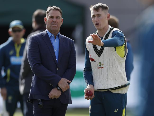 The late great Shane Warne working with Marnus Labuschagne on his bowling at Old Trafford in 2019.