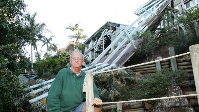 Roger Bell in front of his Lansell Ave home at Currumbin where part of house fell down the hill.