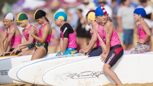 Competitors wait on the start line before the All Ages Board Relay during the Surf Life Saving Central Coast junior branch carnival at Copacabana Beach. Picture: Troy Snook