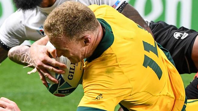 Australia's wing Reece Hodge scores a try during the Japan 2019 Rugby World Cup Pool D match between Australia and Fiji at the Sapporo Dome in Sapporo on September 21, 2019. (Photo by WILLIAM WEST / AFP)