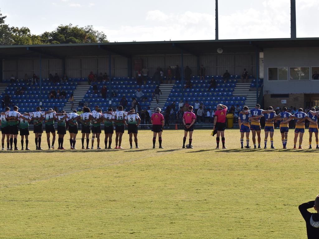 Marist Brothers and Northern United hold a minute silence before the game.