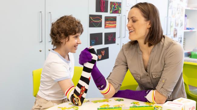 Isabelle (Belle) Northey pictured with Ellie Cole. The Paralympic swimming champion was at Westmead Ronald McDonald House meeting her competitive equal. Picture: Scott Ehler