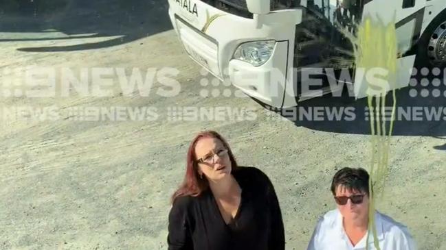 Nikki Hollingshead and Brenda Fladrick of Yatala Bus &amp; Coach surveying the paint damage. Picture: Chennal 9