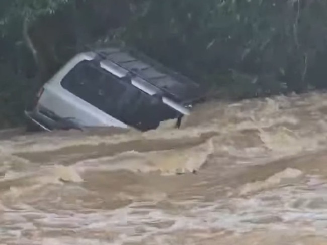 Images of a 4WD half submerged at Amamoor Crossing Creek Number 8, in the Mary Valley. Pictures: Carla Nerea, Facebook.