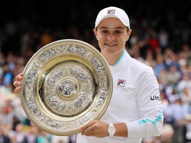 MARCH 23, 2022: World number 1 and three-time Grand Slam winner Ash Barty has announced her retirement from tennis at the age of 25. LONDON, ENGLAND - JULY 10: Ashleigh Barty of Australia celebrates with the Venus Rosewater Dish trophy after winning her Ladies' Singles Final match against Karolina Pliskova of The Czech Republic  on Day Twelve of The Championships - Wimbledon 2021 at All England Lawn Tennis and Croquet Club on July 10, 2021 in London, England. (Photo by Clive Brunskill/Getty Images)