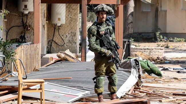 An Israeli army soldier looks on during a patrol in Kfar Aza. Picture: AFP