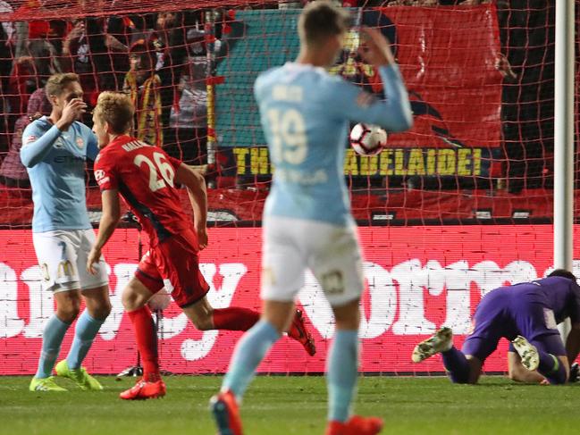 Ben Halloran celebrates the winning goal as City players react to the killer blow.