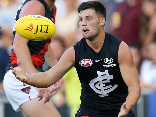 AFL. JLT. Round 1. Carlton v Essendon at Ikon Park. Nic Newman takes possession infront of  zAC cLARKE . Pic: Michael Klein