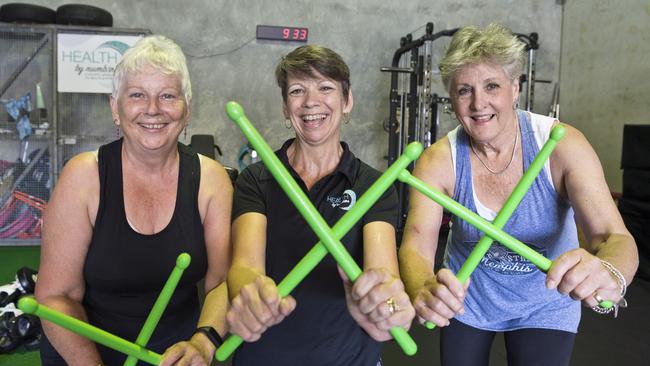 Health by Numbers owner Annemarie Lyons (centre) with Sharon McGarry (left) and Gaye Hawkshaw demonstrate the pound fitness technique combining drumsticks and fitness, Tuesday, February 18, 2020. Picture: Kevin Farmer