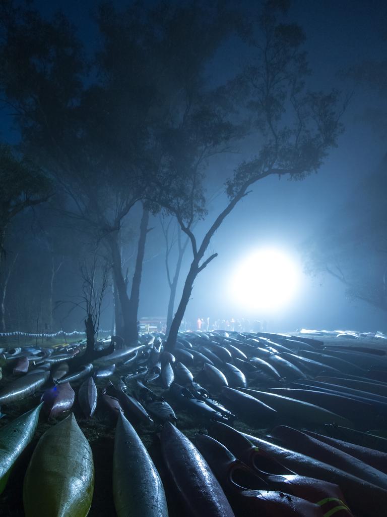 Colin Bartley from Halls Head (WA) Paddlers on a cold misty morning “What a strong and original image this is. It is full of atmosphere and graphics. The single strong back light cutting through the mist is just perfect . The shapes of the canoes look like stranded whales and make the scene somewhat surreal. Picture: 2015 Canon Light Awards