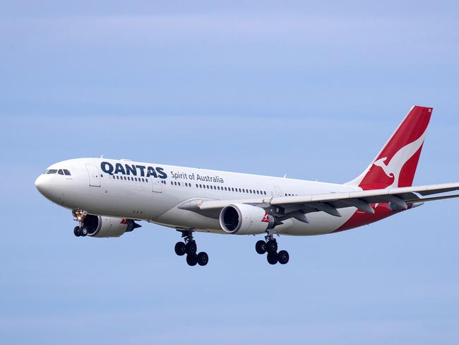 A Qantas plane lands at Tullamarine Airport, Melbourne. Picture: Mark Stewart