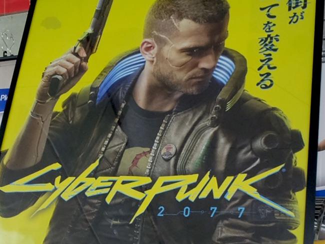 An advertisement for the Cyberpunk 2077 game for the Sony Playstation is seen in the gaming section of a shop in Tokyo on December 18, 2020, as Sony announced the pulling of the much-hyped game from PlayStation stores around the world after a flood of complaints and ridicule over bugs, compatibility issues and even health risks. (Photo by Kazuhiro NOGI / AFP)