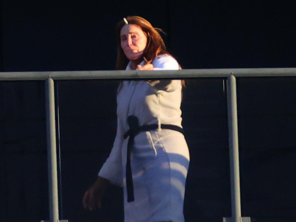 Caitlyn Jenner is pictured throwing her cigarette butt over the hotel balcony. Picture: KHAPGG / BACKGRID