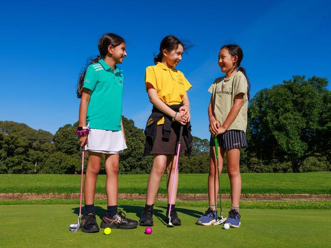 Anaya Badiani, 8, Matisse de Leeuw, 11, and Ruby Zhang, 10, at Moore Park Golf Course, Sydney. Picture: Justin Lloyd.