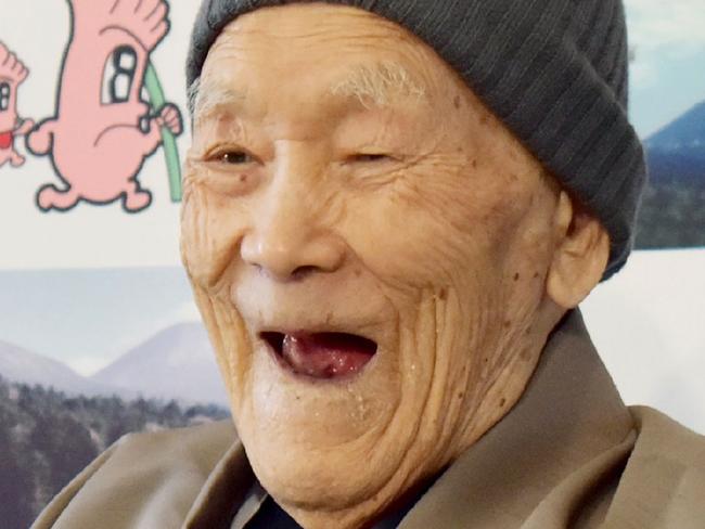 Masazo Nonaka of Japan, aged 112, smiles after being awarded the Guinness World Records' oldest male person living title in Ashoro, Hokkaido prefecture on April 10, 2018. Nonaka was born on July 25, 1905. / AFP PHOTO / JIJI PRESS / JIJI PRESS / Japan OUT