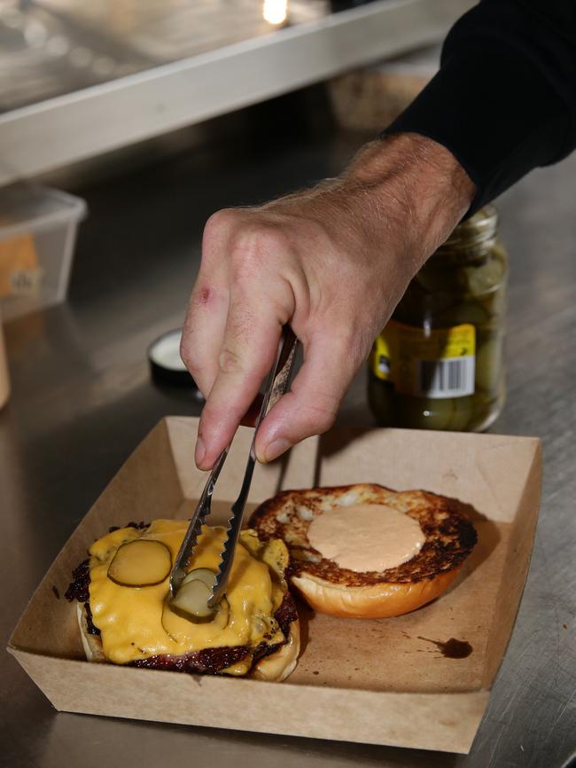 Grant Lawn loves his simple burger. Picture: Craig Wilson