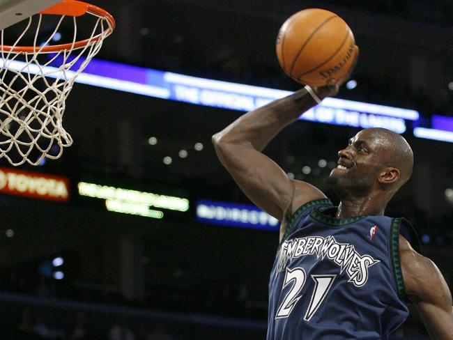 FILE - In this March 18, 2007, file photo, Minnesota Timberwolves' Kevin Garnett (21) goes to the hoop in the second quarter of their NBA basketball game against the Los Angeles Lakers in Los Angeles. Garnett is coming back to the place it all began. A person with knowledge of the deal says the Minnesota Timberwolves are sending forward Thaddeus Young to the Brooklyn Nets for Garnett. The person spoke Thursday, Feb. 19, 2015, on condition of anonymity because the deal had not been officially announced. (AP Photo/Gus Ruelas, File)