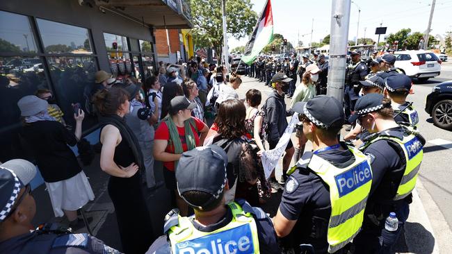 Pro-Palestine protesters are surrounded by police at the perimeter of the Flemington Racecourse on Melbourne Cup Day. Picture: AAP Image/Con Chronis