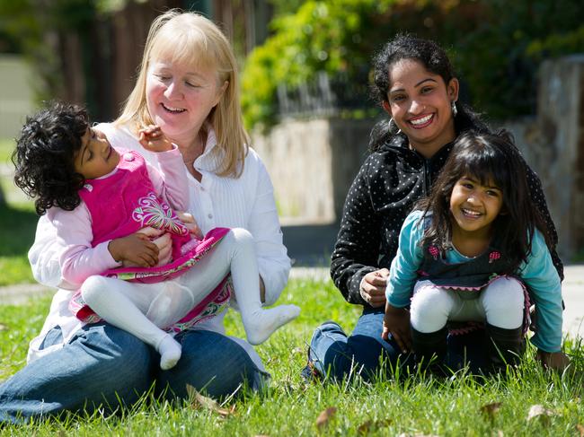 Krishna and Trishna (long hair) with their biological mother, Lavlee Mollik and Moira Kelly.