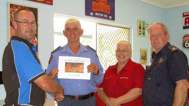 WIDGEE NEWS: Peter & Karen Alexander of Widgee General Store were presented with a Certificate of Appreciation for their continued support of Widgee Rural Fire Brigade by First Officer Barry Dyer (second from left) and Brigade Chairman Chris Lhotka (right).